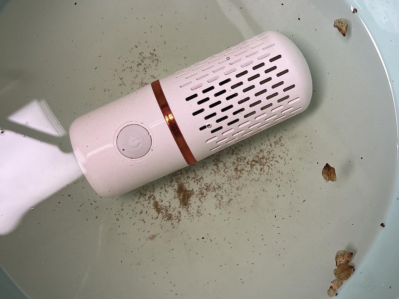 PurePod in dirty water with visible wax and residue